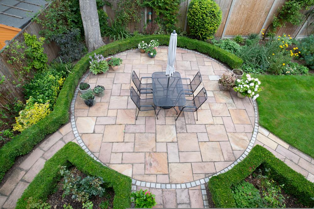 circular,garden,patio,with,freshly,jet,washed,paving,stones